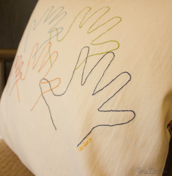embroidered hand print pillow