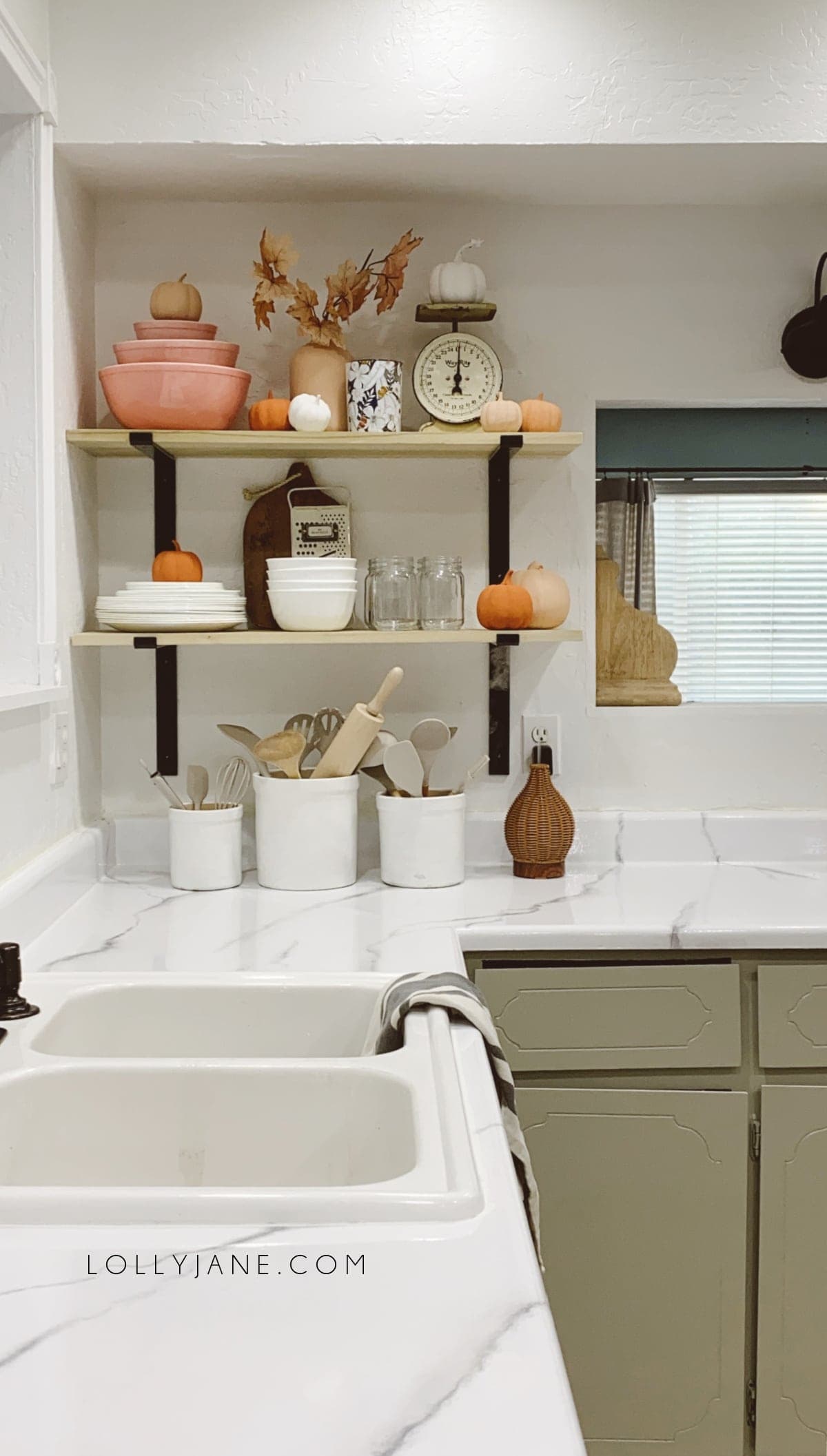 DIY Open Kitchen Shelves | Easy open kitchen shelves that totally changed this room! You've GOT to see the 40 year old kitchen and how we updated it for a few hundred bucks with epoxy countertops and open kitchen shelving!! Loving these open kitchen shelves! #openkitchenshelves #diyshelves #howtohangsheleves #openkitchenshelves #openkitchenshelving #openkitchenideas #howtostylekitchenshelves #falldecorating #fallkitchenshelves