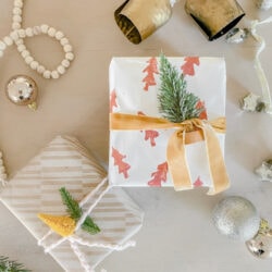In a pinch for festive gift wrap? Grab a potato and some paint to make a festive design in no time... on the backside of ANY type of wrapping paper!