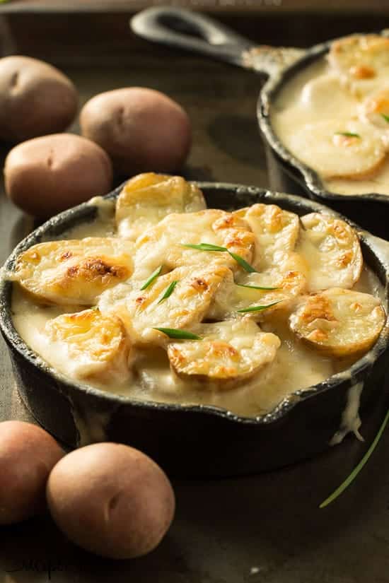 The best and easiest scalloped potatoes -- they're cooked completely in one skillet so there's no boiling the potatoes or cooking the sauce separately! 