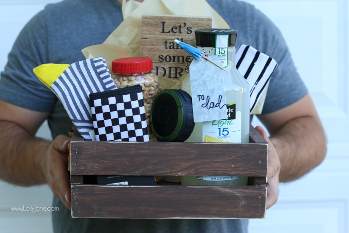 DIY Father's Day gift basket | Grab this premade crate but dress it up with some paint and leather handles. Fill it with your dad's favorite goodies to create the perfect Father's Day gift! Love this DIY Fathers Day gift basket!