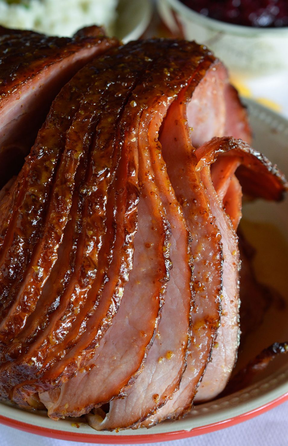 Pineapple Honey Glazed Ham Recipe - This is a simple and delicious holiday meal! A flavorful glaze made with pineapple juice, dijon mustard and honey for your spiral ham..