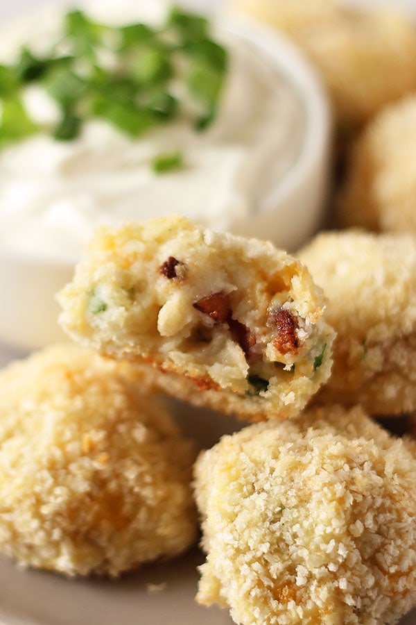 Loaded Leftover Mashed Potato Balls take advantage of extra Thanksgiving mashed potatoes by turning them into something even better. Baked, not fried! With cheddar, bacon, onion, and sour cream!