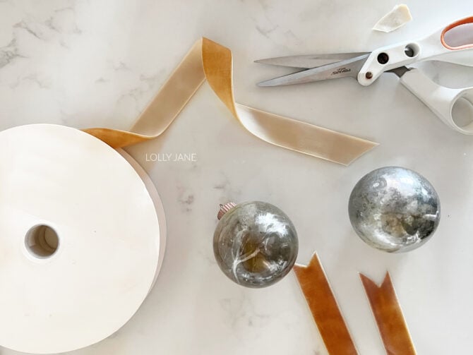 DIY Mercury Glass Christmas Ornaments, so easy to make and looks so fancy! These started off as boring, clear plastic ornaments and now they look chic and expensive! Wow!