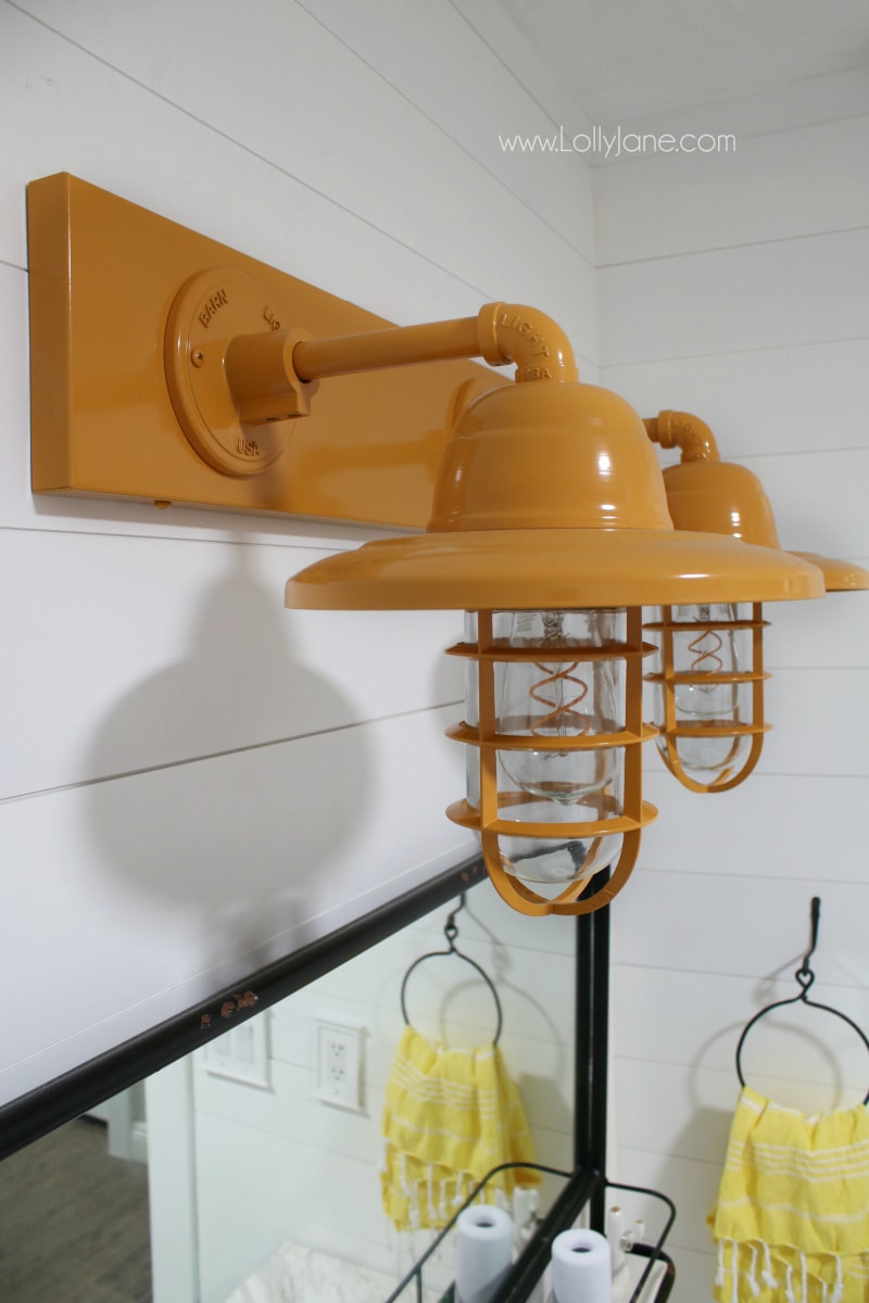 So in love with this yellow barn light bathroom decor in this farmhouse renovation.
